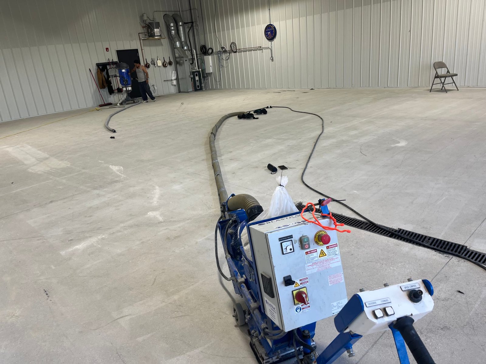 Diamond grinding a commercial concrete slab to a coating-ready profile